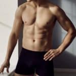 male model with athletic body wearing comfortable black cotton underpants standing