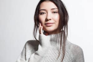 Woman outside in the winter time with glowing skin