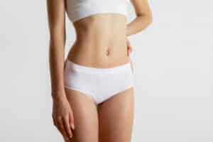 Woman in white underwear has a tight body after skin tightening with J-plasma.